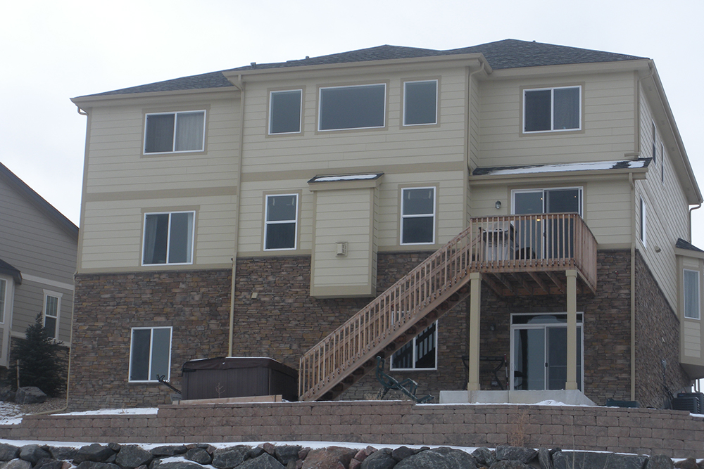 Colorado Creations Stamped Patio Stamped Concrete Spiral Metal Staircase - BEFORE