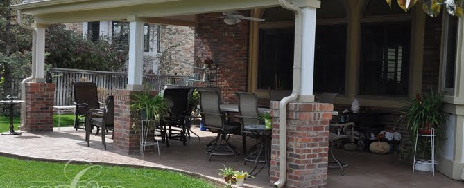 Refined Covered Patio with Grill and Accent Lighting