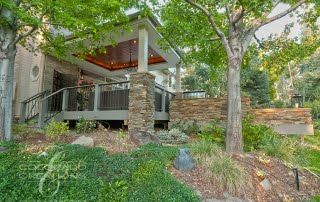 Architectural Covered Deck with Flatstone Accents and Integrated Lighting