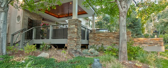 Architectural Covered Deck with Flatstone Accents and Integrated Lighting
